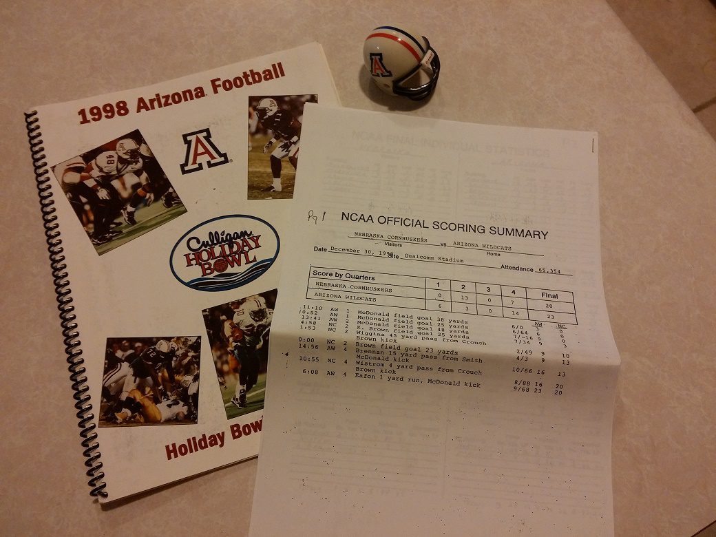 The 1998 Holiday Bowl Media Guide and final official scoring summary of Arizona's  historic 23-20 win over Nebraska (Javier Morales/AllSportsTucson.com)