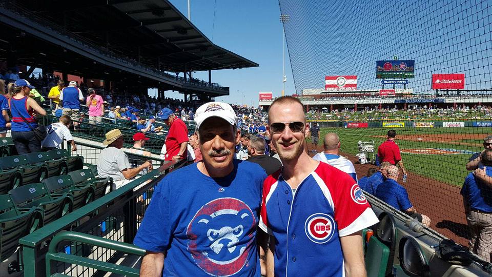 Mike Feder (left) wearing his lucky Cubs shirt standing next to his nephew at  a Chicago spring training game (Feder family photo)