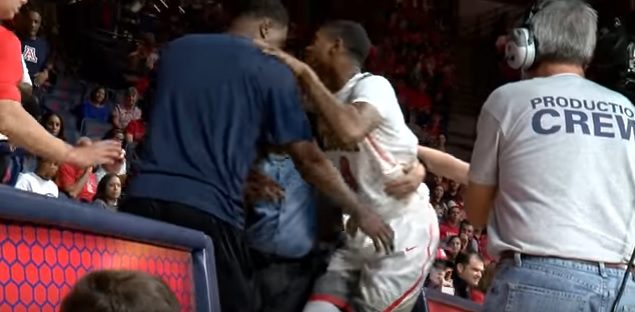Ray Smith is helped off floor Tuesday night after tearing his right ACL (YouTube video capture)