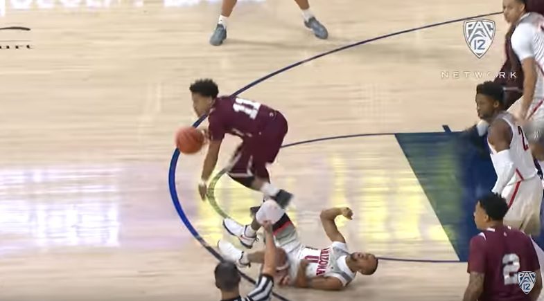 Parker Jackson-Cartwright writhing in pain after going down awkwardly trying to maneuver around a screen last night against Texas Southern (Pac-12 Neworks video capture)
