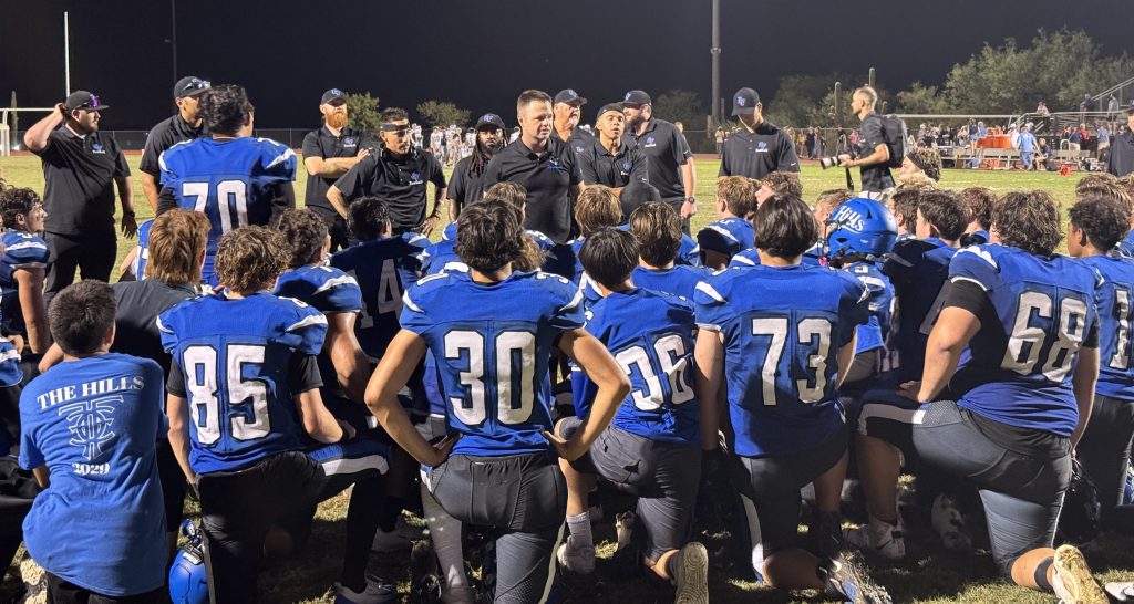 Catalina Foothills head coach Daniel Sainz talking to his players after their 21-17 victory over Ironwood Ridge.