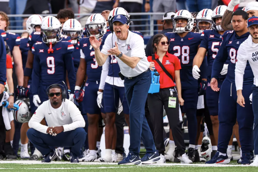 Brent Brennan celebrates on the sideline during the win over Baylor
