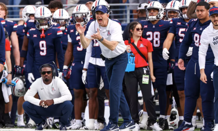 Brent Brennan celebrates on the sideline during the win over Baylor