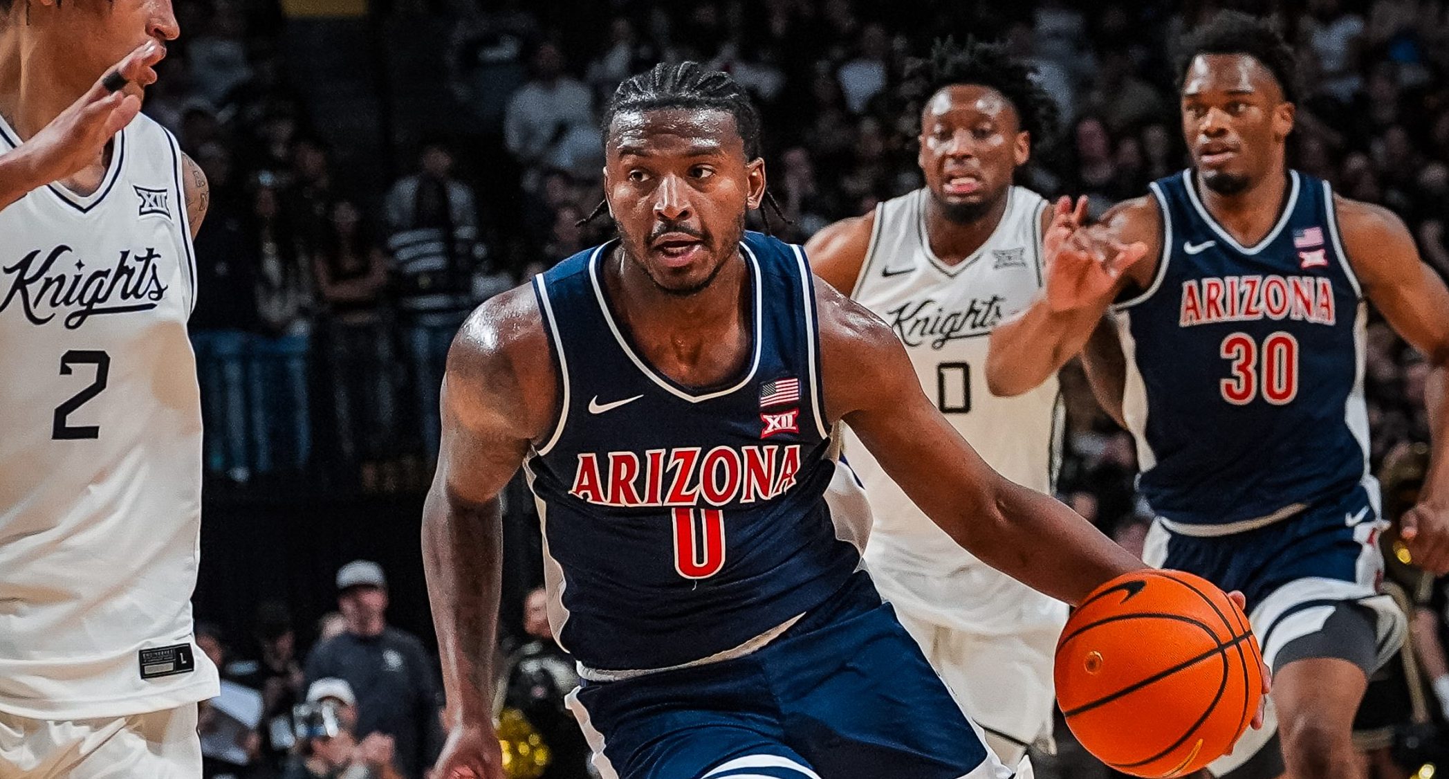 No. 1 Arizona withstands UCF's challenge, improves to 18-0